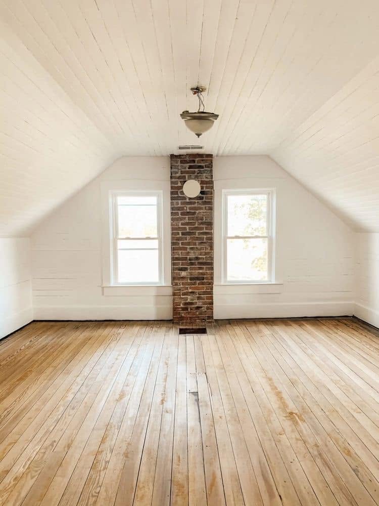 Refinished solid hardwood flooring in a bright Charlotte area home